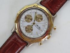 A contemporary Chronograph wrist watch on leather strap in metal presentation box.