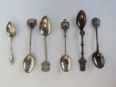 A sterling silver New York themed souvenir spoon together with two HM silver spoons and an EPNS