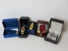 Five assorted boxed watches including Rotary.