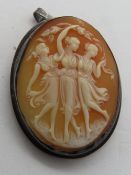 A carved shell cameo brooch/pendant featuring three muses dancing, 38mm in length.