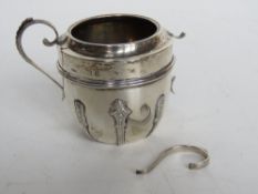 A hallmarked silver twin-handled cup, one handle a/f, 121.9g / 3.93ozt.