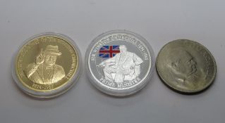 Three Churchill commemorative coins including two proof coins in packaging.