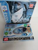 A boxed graphics card and mother board.