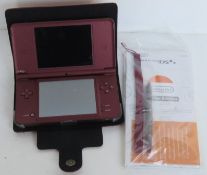 A Nintendo DS XL in burgundy with case, instructions and stylus.