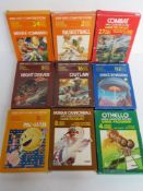 Nine vintage boxed Atari video computer games inc PacMan, Space Invadors, Outlaw, etc.