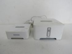 A Sonos Multiroom Music System ZP90 and bridge, bridge with cable.