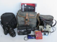 A quantity of cameras and camera equipment inc Canon Camcorder, Nikon, Prinz Flashgun,