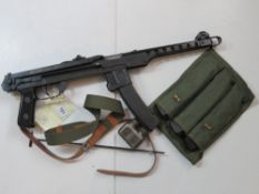A deactivated Polish PPS-43 7.62mm sub machine gun with accessories.