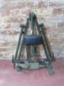 A DISA Tripod with carry straps.
