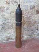 An inert WWI French 75mm shell, fuse unscrews, projectile is semi pitted. Approx. 62cm tall.