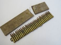 A Japanese 7.7 Woodpecker strip with 30 inert rounds in box.