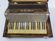 A Hess Klingenthl piano accordion in original case, mother of pearl effect key, 48.