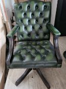 A green Chesterfield type office chair for refurbishment (damage to base, castors deficient).