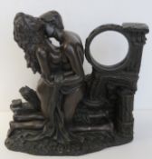 A bronzed resin sculpture of lovers in embrace, measuring approx 28cm high x 27cm wide.