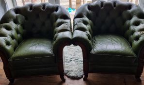 A pair of green leather Chesterfield type armchairs, arm a/f for restoration.