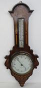 A fine Edwardian barometer with mercury thermometer over, having inlaid design throughout,