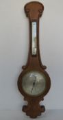 An early 20thC barometer and mercury thermometer measuring approx 96cm in length.