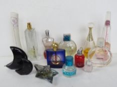 A quantity of assorted part used perfumes including Gaultier, Armani, Ghost, Yves St Laurent,