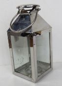 A contemporary chrome and glass “storm lantern” 38cm high
