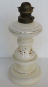 A milk glass oil lamp. No shade or chimney.