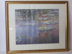 Print; Monet Waterlillies, framed and glazed in gold painted pine frame.
