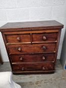 A Victorian mahogany chest of two short over three long drawers, turned wooden handles,
