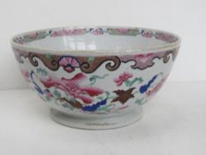 A fruit bowl having Oriental inspired floral design upon, in pinks and blues approx 29cm dia.