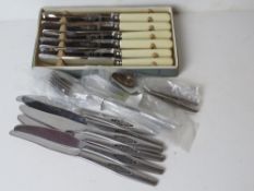 A quantity of mid century cutlery including some Scandinavian style.