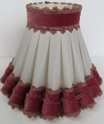 A pink and white part velvet lampshade approx 40cm wide.