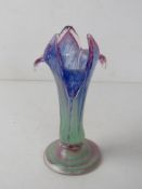 A hand blown Art Glass vase in the form of a flower standing 21cm high.