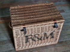 A Fortnum and Masons wicker hamper having end handles.
