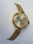 A vintage ladies Rotary wristwatch, manual, 17 jewels, on rolled gold strap.
