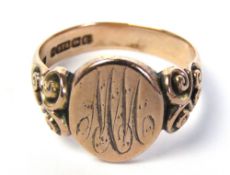 A 9ct rose gold mens signet ring, the oval head bearing MM monogram,