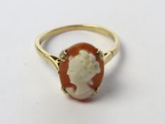 A 9ct gold cameo ring, the carved shell panel measuring 1.