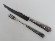 A hallamrked silver handled cake knife together with HM silver handled pickle fork.