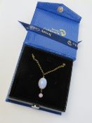 A costume jewellery 'opal' necklace in presentation box.