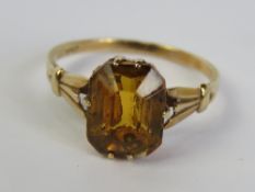 A vintage 9ct gold cocktail ring having orange quartz octagonal cut stone in six claw setting,