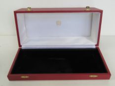 Cartier; a red leatherette presentation box, contents deficient.