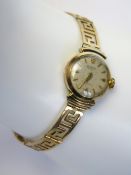 A ladies 14ct gold manual cocktail watch by Silvana,