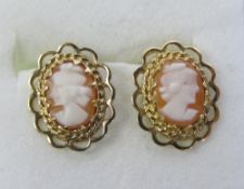 A pair of cameo stud earrings with butterfly backs,