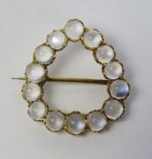 A delightful wreath style teardrop shaped moonstone brooch,