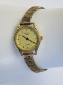 A vintage 9ct gold ladies watch strap having bark effect articulated panels,