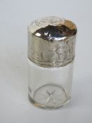 A hallmarked silver and cut glass dressing table bottle, with stopper.