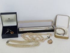 A hallmarked silver bangle having floral engraving,