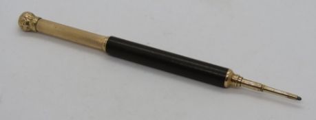 A Mabie Todd & Co propelling pencil, brown barrel with yellow metal terminals c.1900.