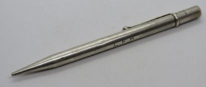 A hallmarked silver propelling pencil, HM London 1946, engraved LFK.