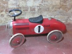 A childs ride on Ford racing car.