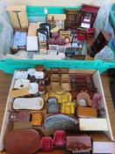 A quantity of assorted dolls house furniture in ceramic and wood.