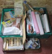 Two crates of dolls house making and decorating items including bricks, grass sheets, wallpaper,