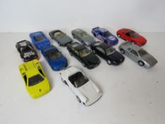Twelve scale model vehicles including Lotus, Aston Martin, BMW, Lamborghini, etc.